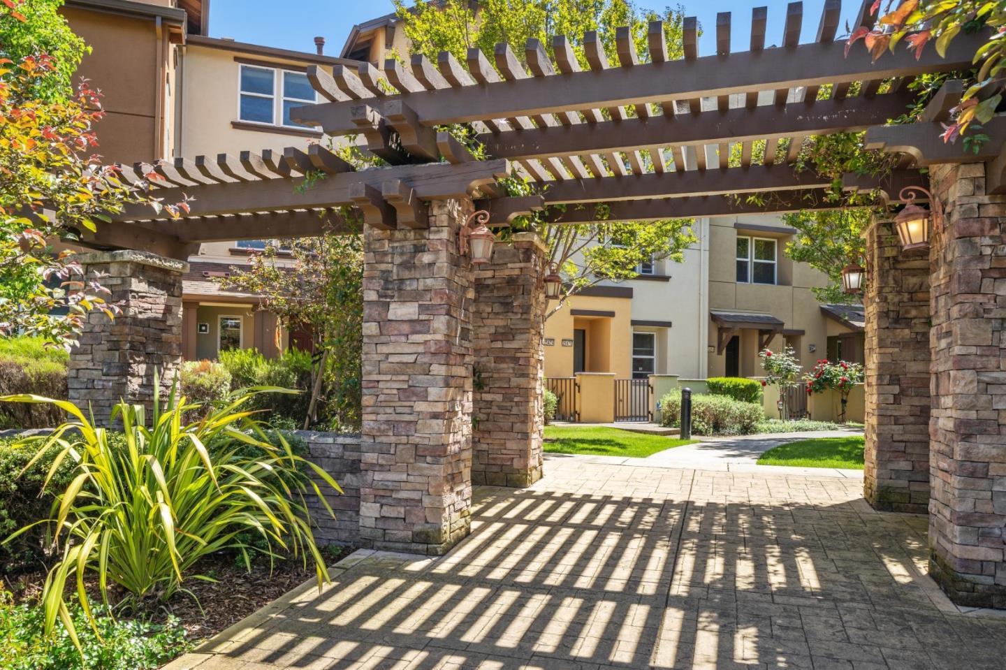 25478 Huntwood Avenue Hayward, CA 94544 - Photo 31 of 35 a view of a brick building with a bench in front of a house
