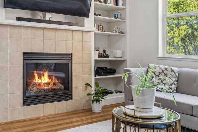a living room with furniture and a fireplace