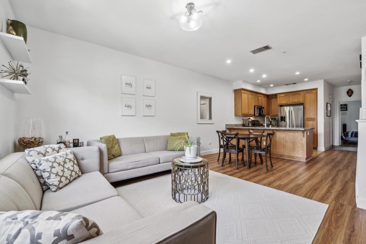 25478 Huntwood Avenue Hayward, CA 94544 - Photo 6 of 35 a living room with furniture kitchen view and a dining table