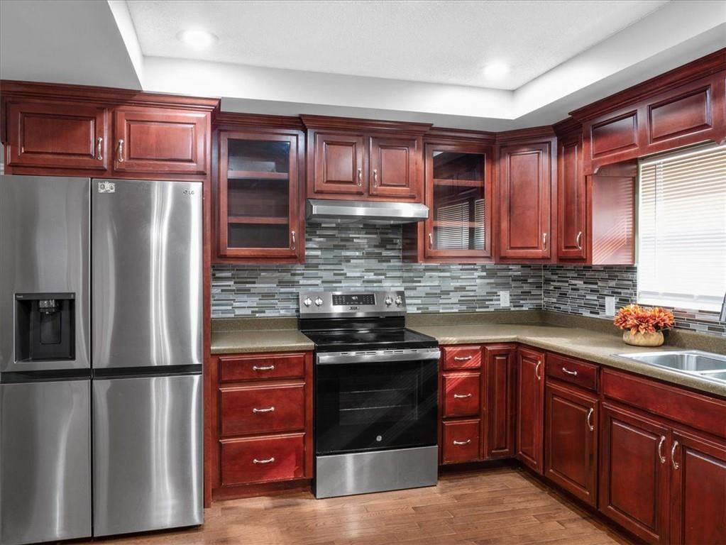 1115 Ila Road Commerce, GA 30530 - Photo 11 of 38 a kitchen with stainless steel appliances granite countertop a refrigerator and a sink