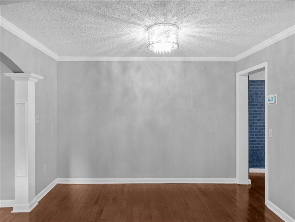 1115 Ila Road Commerce, GA 30530 - Photo 12 of 38 a view of empty room with wooden floor and fan