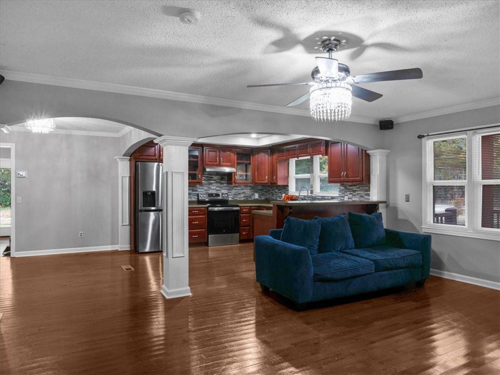 1115 Ila Road Commerce, GA 30530 - Photo 17 of 38 a living room with stainless steel appliances granite countertop furniture and a kitchen view