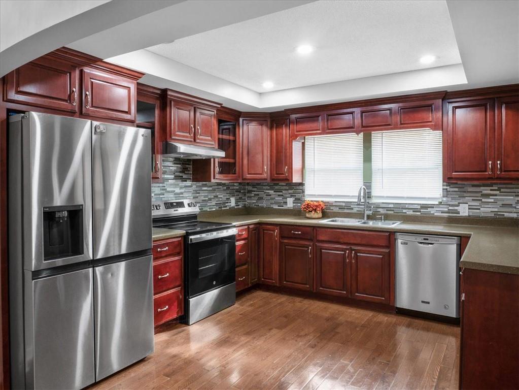 1115 Ila Road Commerce, GA 30530 - Photo 10 of 38 a kitchen with stainless steel appliances granite countertop a refrigerator a sink dishwasher a stove and a refrigerator