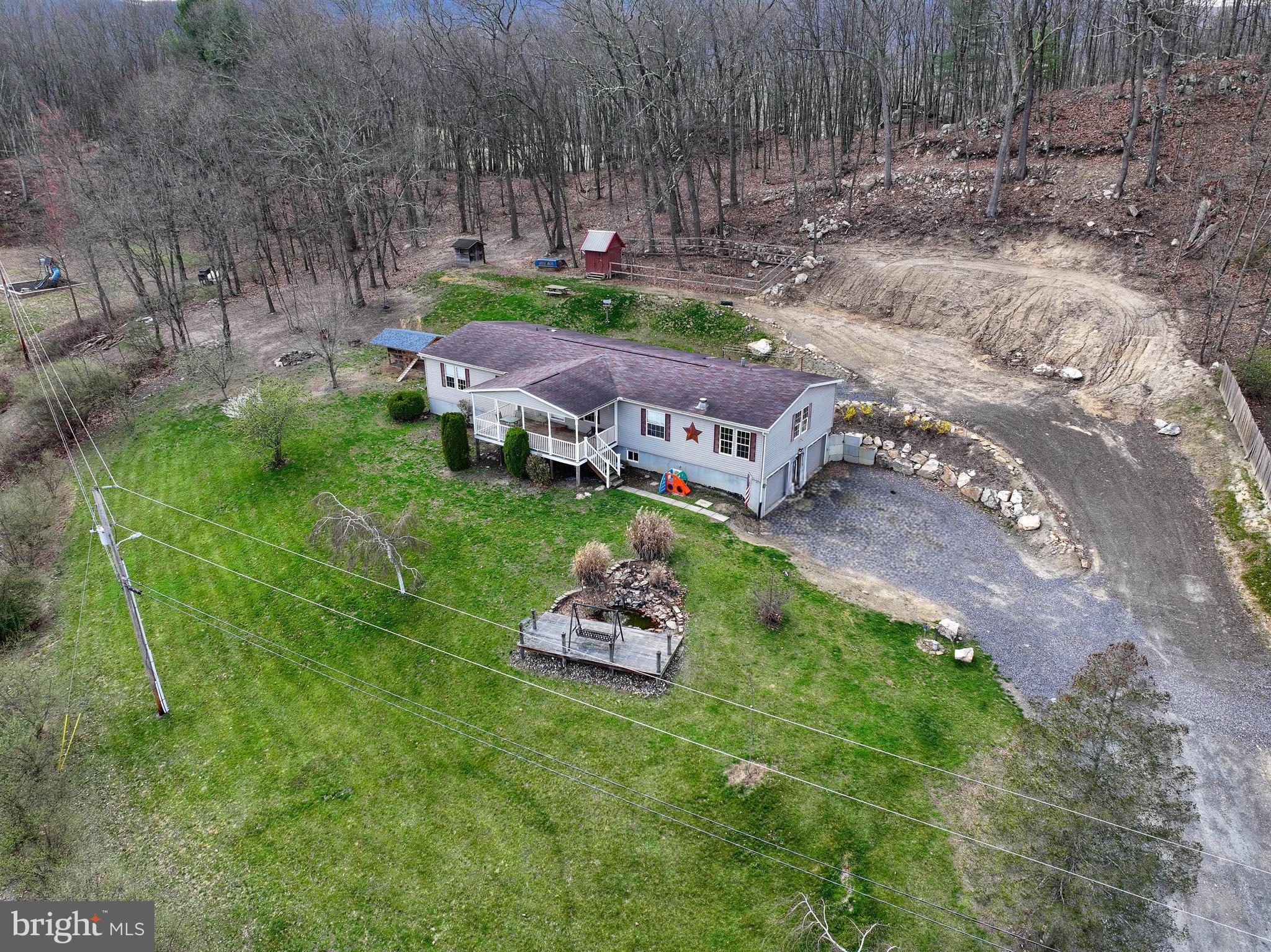192 Northern Pine Road Hopewell, PA 16650 - Photo 2 of 66 a backyard of a house with outdoor seating