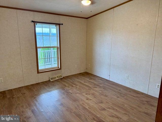 192 Northern Pine Road Hopewell, PA 16650 - Photo 25 of 66 an empty room with wooden floor and windows