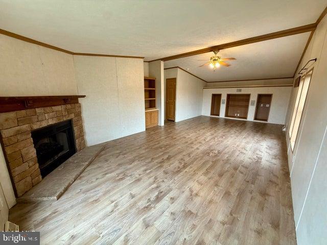 192 Northern Pine Road Hopewell, PA 16650 - Photo 4 of 66 a view of a livingroom with wooden floor and a fireplace
