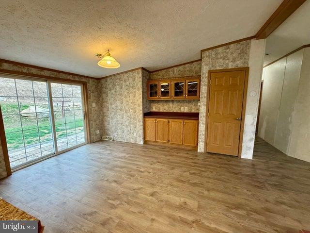 192 Northern Pine Road Hopewell, PA 16650 - Photo 6 of 66 a view of an empty room with window and wooden floor