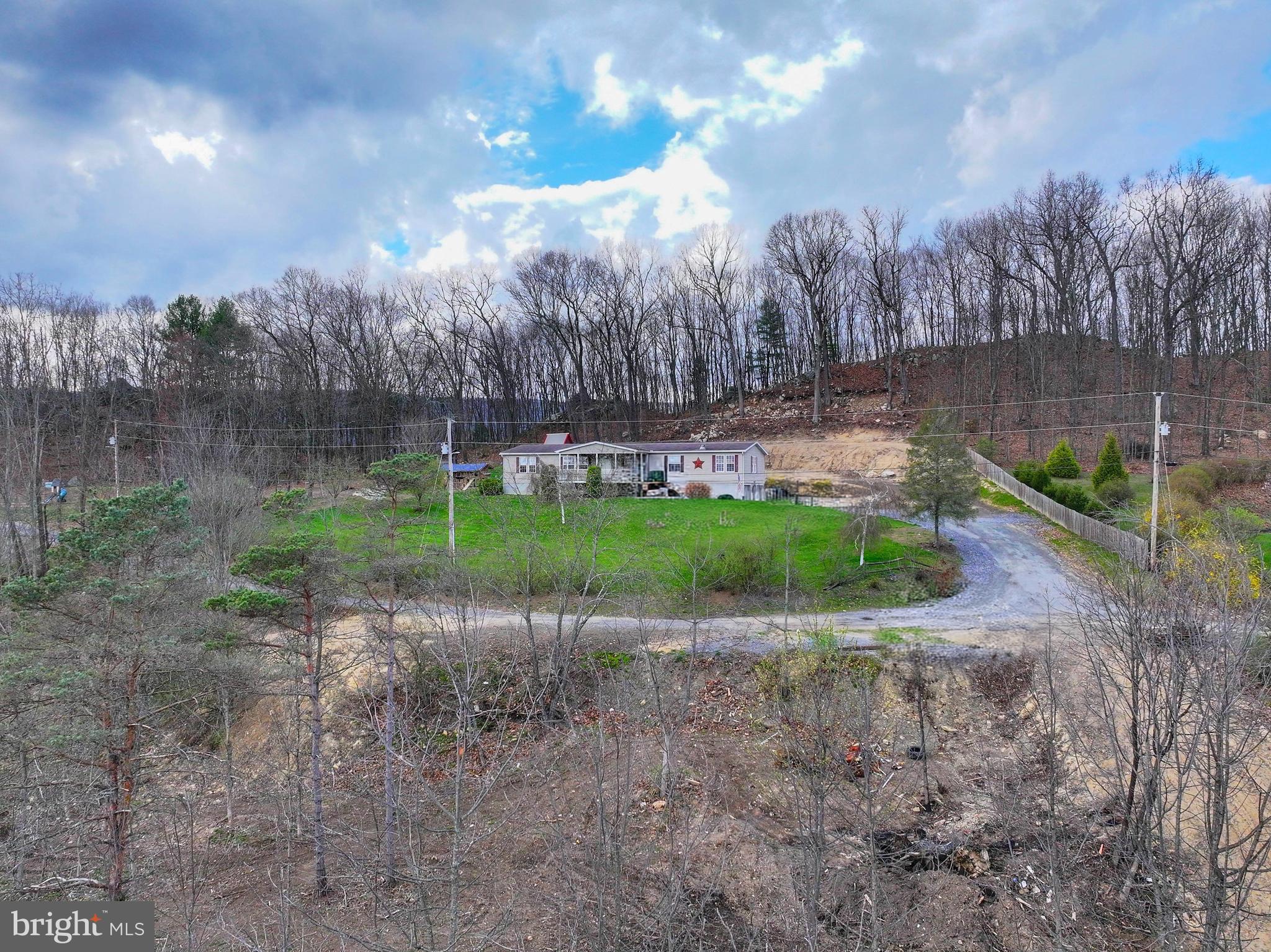 192 Northern Pine Road Hopewell, PA 16650 - Photo 62 of 66 a view of a yard with a fountain in the background
