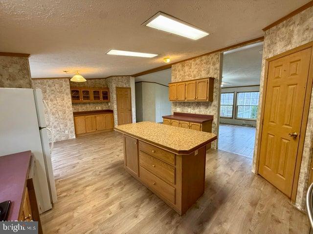 192 Northern Pine Road Hopewell, PA 16650 - Photo 8 of 66 a kitchen with a refrigerator sink and wooden floor