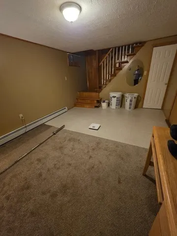 a view of an empty room with stairs