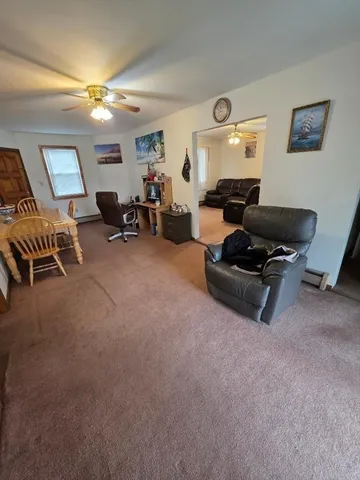 a living room with furniture and a window