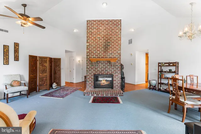 a reading room with furniture and a window