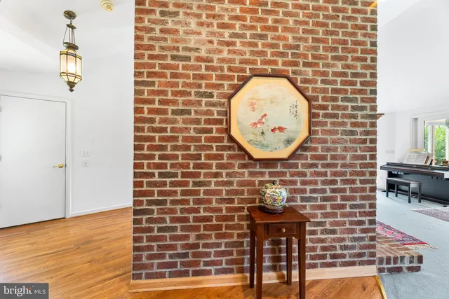 a living room with furniture and a book shelf
