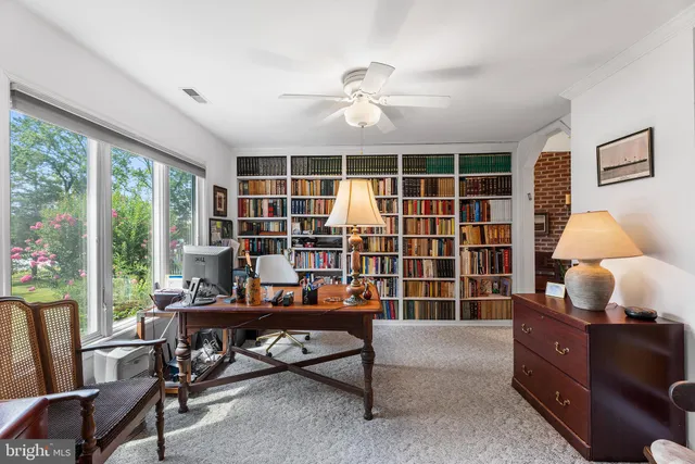 a kitchen with granite countertop cabinets stainless steel appliances a sink and a window