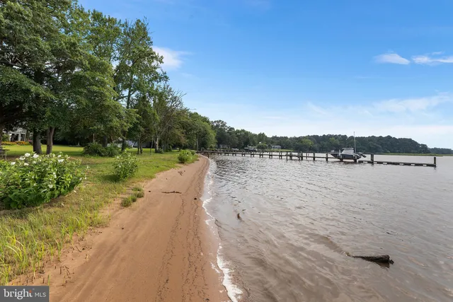 a view of a lake with outdoor seating