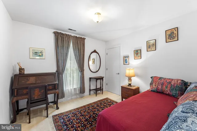 a bathroom with a sink mirror vanity and toilet