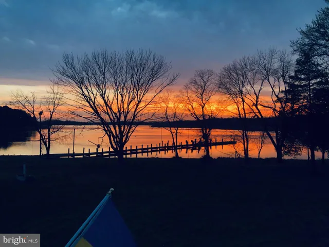 a front view of a house with a yard garage and outdoor seating
