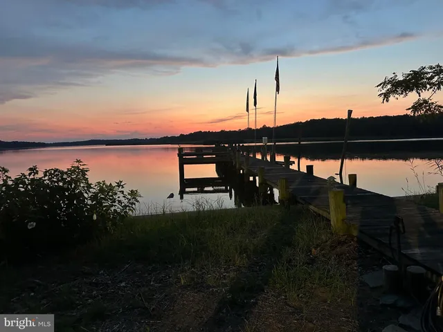 a view of a swimming pool with an outdoor space and seating area