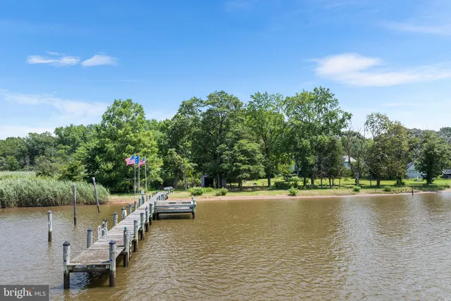 a view of a swimming pool with a table and chairs