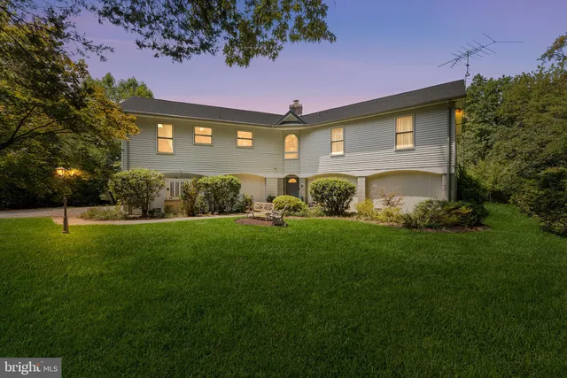 a bedroom with furniture and a book shelf