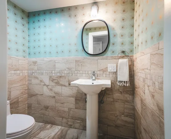 a bathroom with a sink a mirror a toilet and a shower