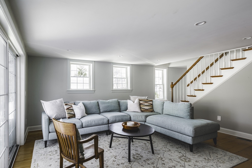 176 Hale Street Beverly, MA 01915 - Photo 15 of 41 a living room with furniture and a potted plant on table