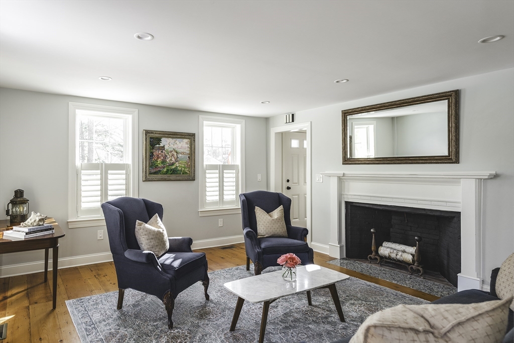 176 Hale Street Beverly, MA 01915 - Photo 16 of 41 a living room with furniture and a fireplace