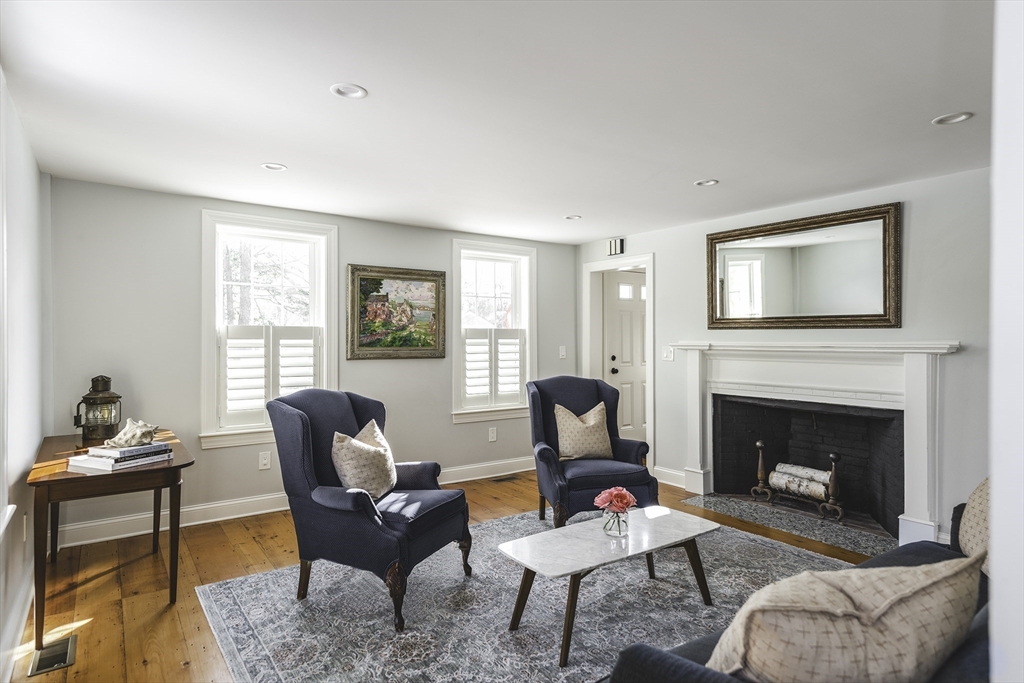 176 Hale Street Beverly, MA 01915 - Photo 17 of 41 a living room with furniture and a fireplace