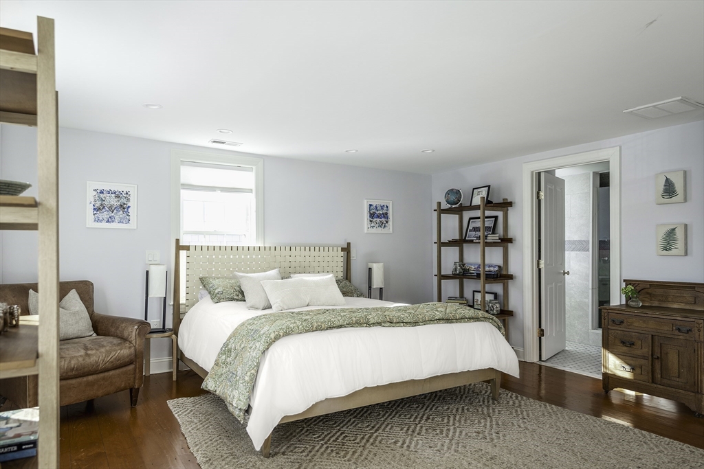 176 Hale Street Beverly, MA 01915 - Photo 20 of 41 a bedroom with a bed a couch and a window