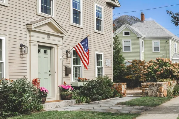 a front view of a house with garden