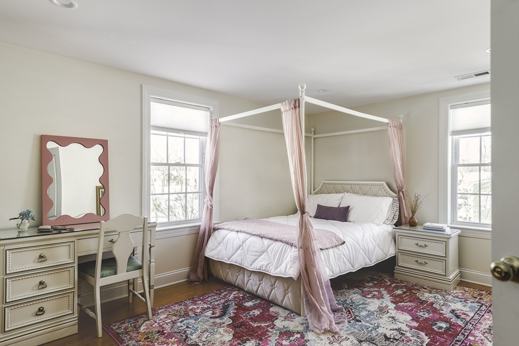 176 Hale Street Beverly, MA 01915 - Photo 22 of 41 a bedroom with a bed and wooden floor