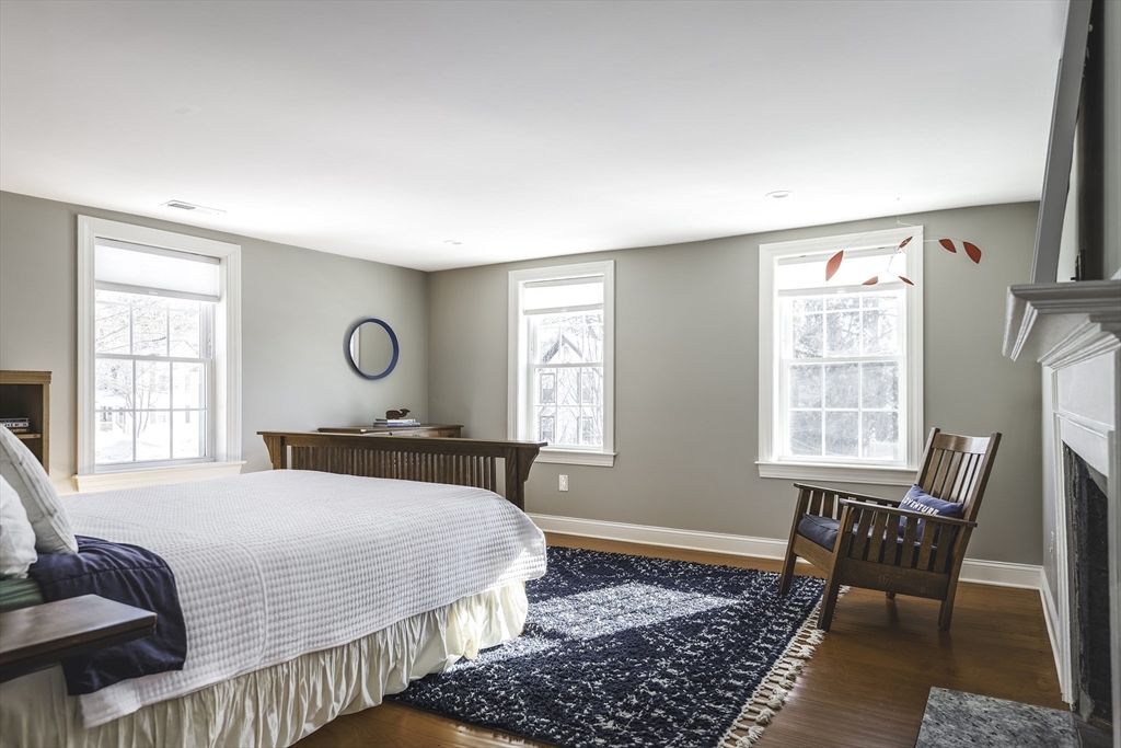176 Hale Street Beverly, MA 01915 - Photo 23 of 41 a bedroom with a bed a table and chair