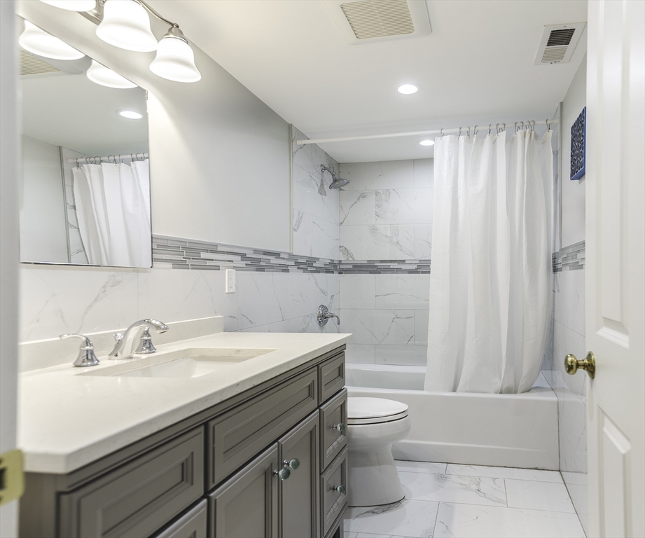 176 Hale Street Beverly, MA 01915 - Photo 24 of 41 a bathroom with a sink a toilet and shower