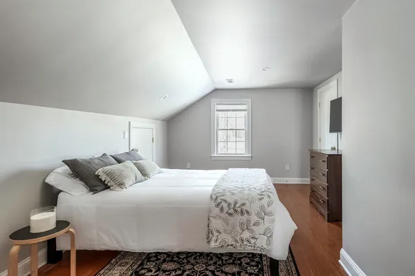 a bedroom with furniture and a couch