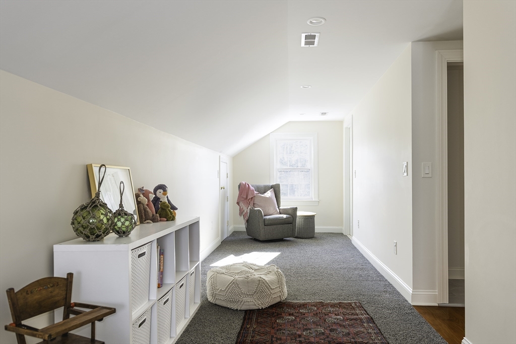 176 Hale Street Beverly, MA 01915 - Photo 26 of 41 a bedroom with furniture and a couch