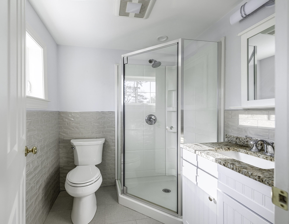 176 Hale Street Beverly, MA 01915 - Photo 27 of 41 a bathroom with a granite countertop sink toilet and shower