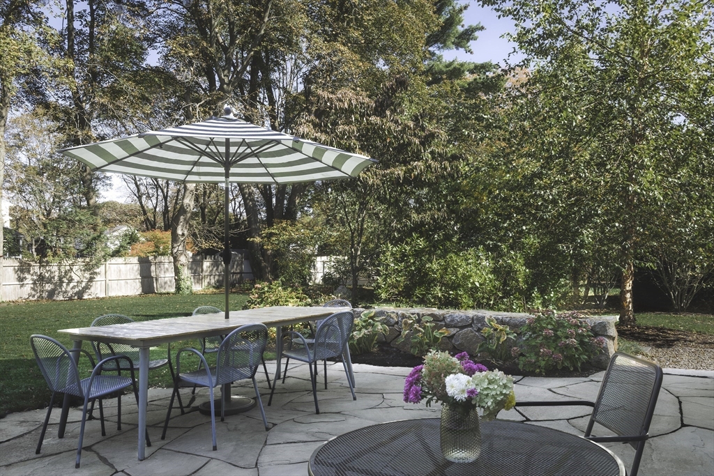 176 Hale Street Beverly, MA 01915 - Photo 36 of 41 an outdoor sitting area with furniture and umbrella
