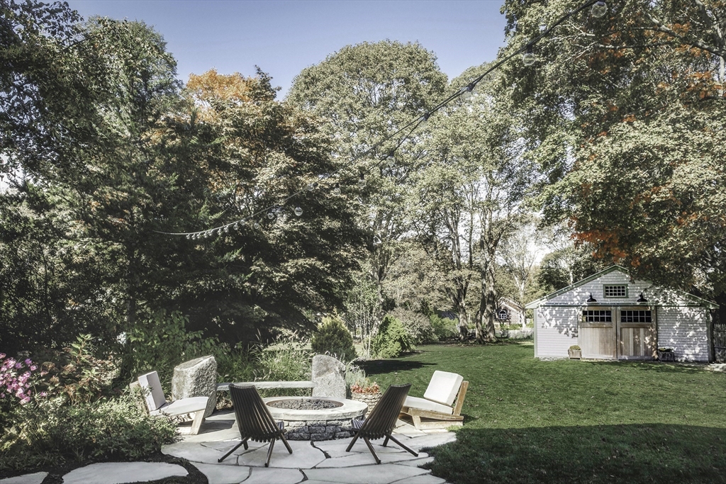 176 Hale Street Beverly, MA 01915 - Photo 38 of 41 a view of a house with backyard sitting area and garden