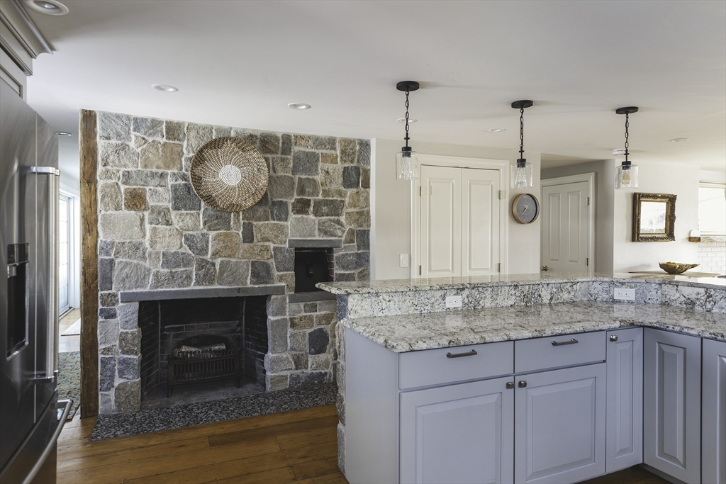 176 Hale Street Beverly, MA 01915 - Photo 7 of 41 a kitchen with granite countertop a sink cabinets and wooden floor