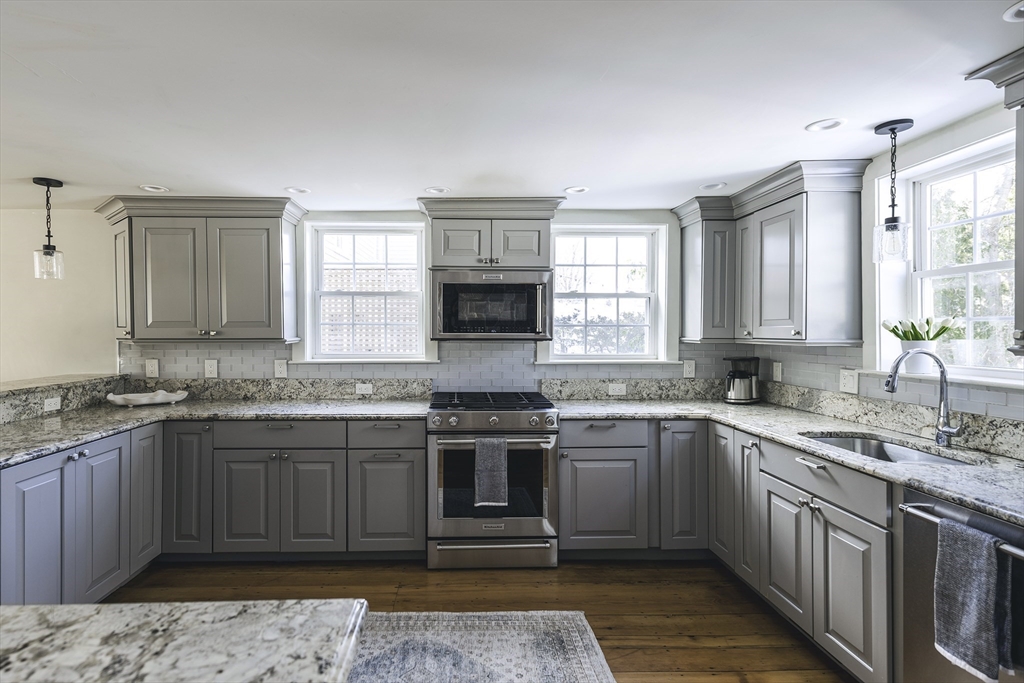 176 Hale Street Beverly, MA 01915 - Photo 9 of 41 a kitchen with a sink stove top oven and cabinets