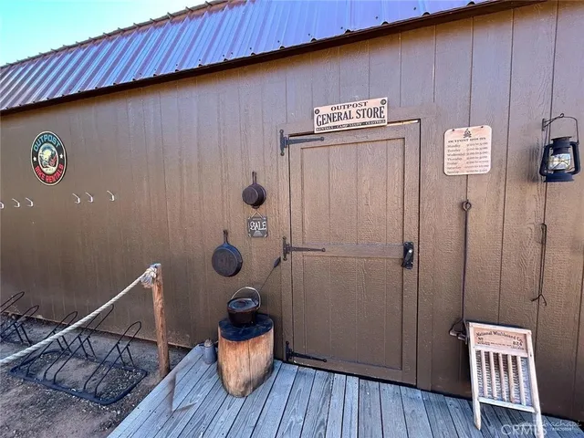 a view of a room with wooden wall and chair