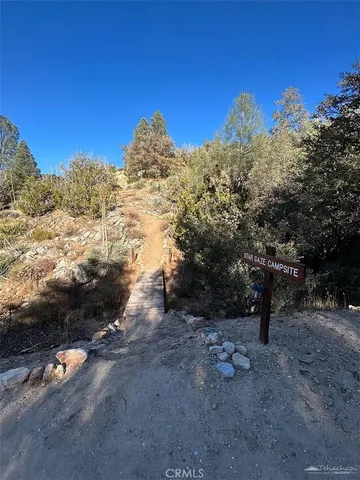 a view of a road with mountains in the background