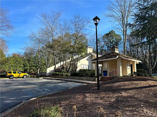 a view of road with large trees