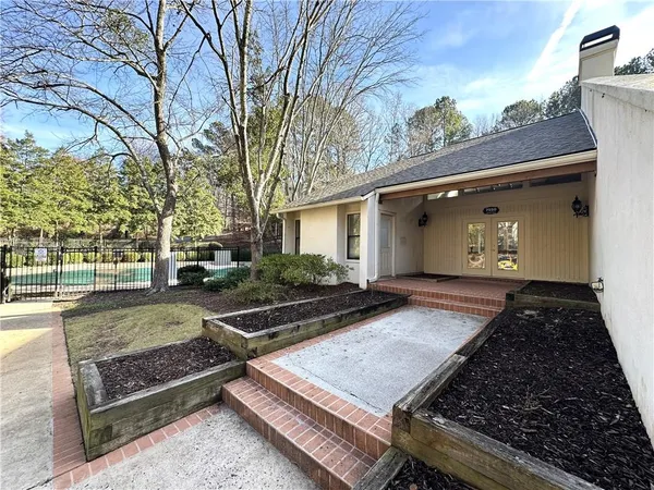 a view of backyard with a flat screen tv