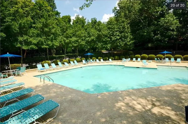 a view of a swimming pool with a lounge chair