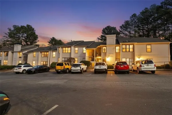 a view of a cars parked in front of a house