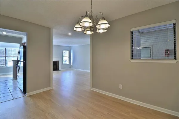 wooden floor in an empty room with a mirror