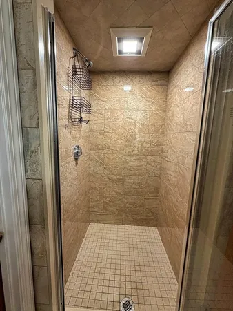 a bathroom with a toilet a sink and a mirror
