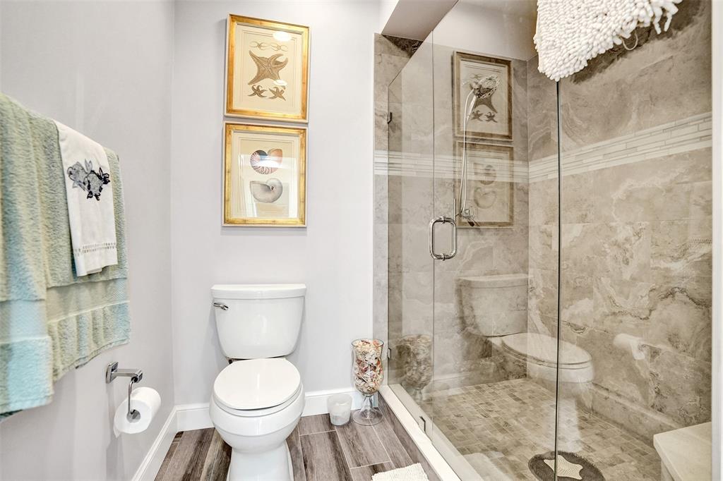 5900 Old Ocean Boulevard, Unit A9 Ocean Ridge, FL 33435 - Photo 17 of 29 a bathroom with a toilet sink and shower