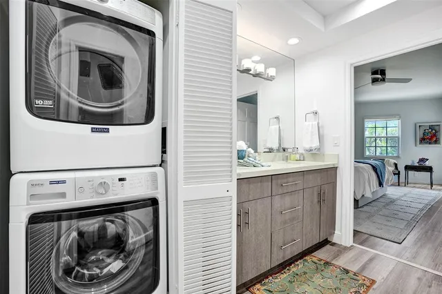 a utility room with sink dryer and washer